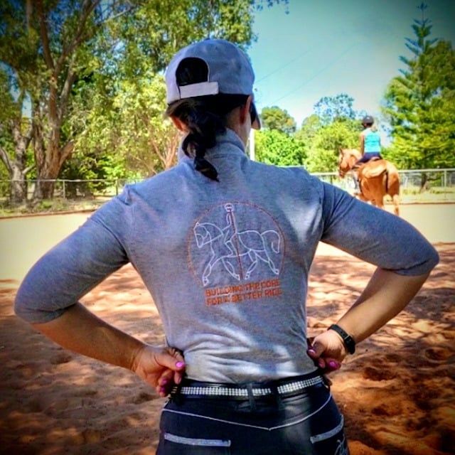 Katrin observing a rider during an outdoor coaching session
